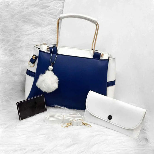 Blue and white handbag with a matching pouch on a textured white surface