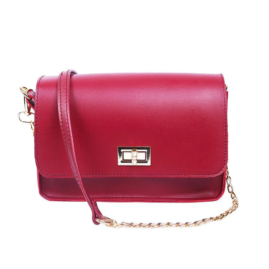 Red handbag with a gold chain strap on a white background