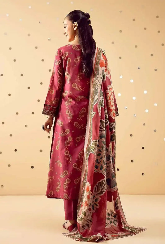 Woman wearing a pink traditional outfit with a floral dupatta against a beige background