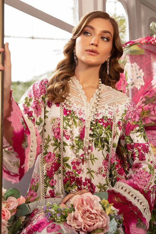 Woman wearing a floral and embroidered outfit with a blurred indoor background