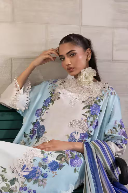 Woman wearing a floral dress with a white lace collar against a tiled wall.