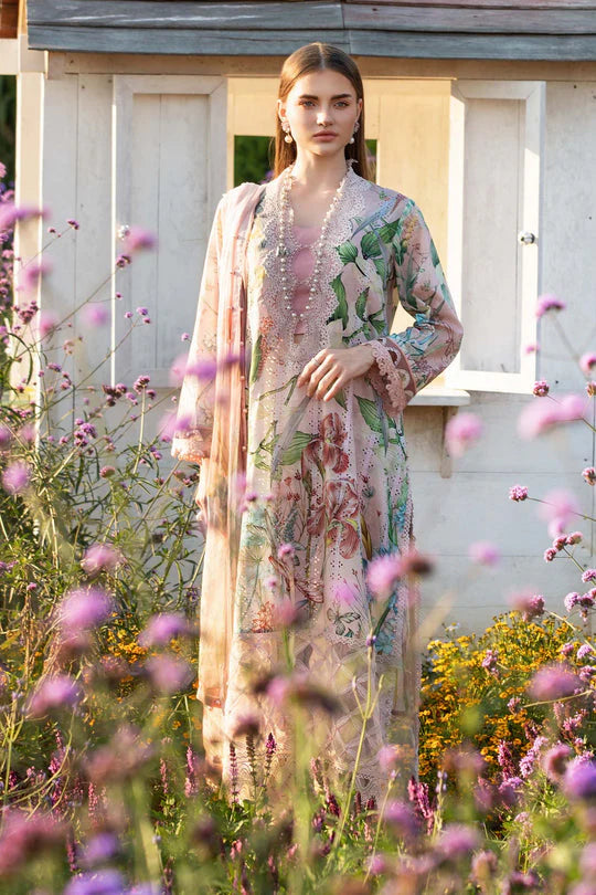 Woman in a floral dress standing in a garden with flowers around her