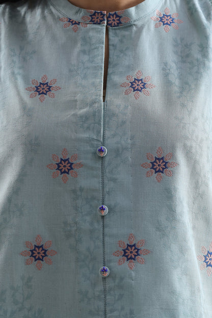 Light blue kurta with floral patterns on a plain background