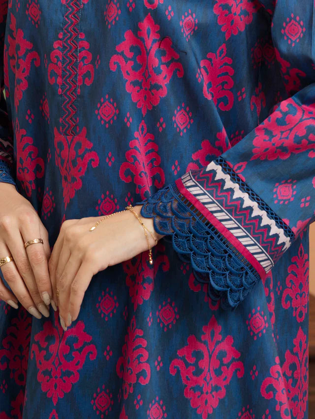 Navy blue fabric with red intricate patterns and white lace trim.