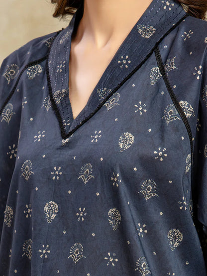 Navy blue shirt with white floral patterns on a neutral background