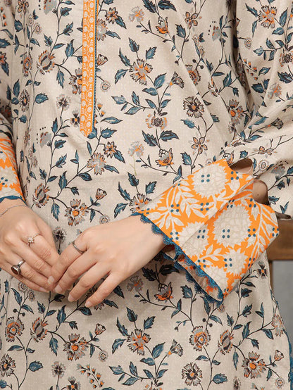 Close-up of a person wearing a floral patterned outfit with orange accents.