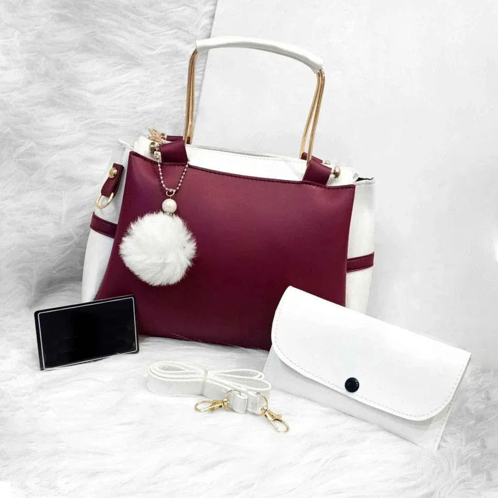 Purple handbag with white accents and a matching pouch on a white background