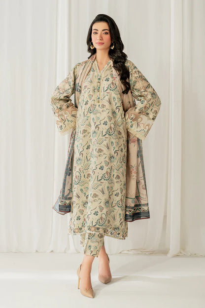 Woman wearing a floral dress and dupatta against a white curtain background