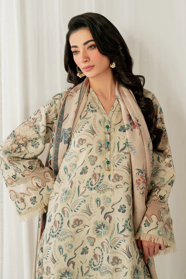 Woman wearing a floral patterned outfit with a scarf against a white background