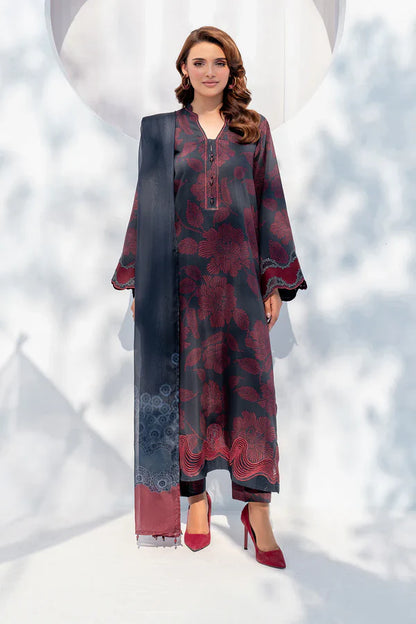 Woman wearing a long, patterned dress with a scarf against a snowy background