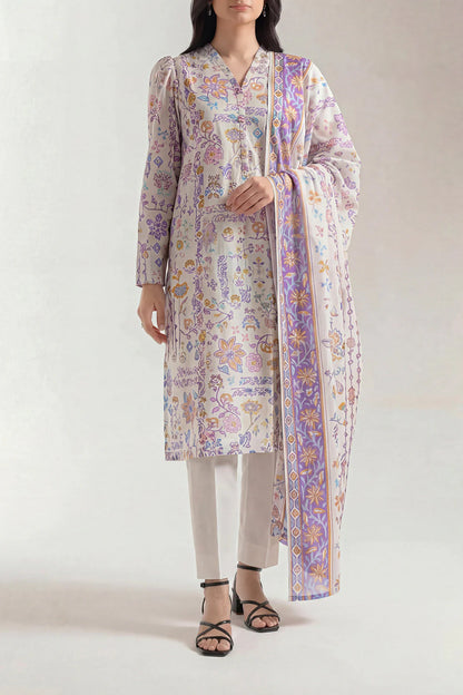 Woman wearing a floral kurta with a matching dupatta on a white background