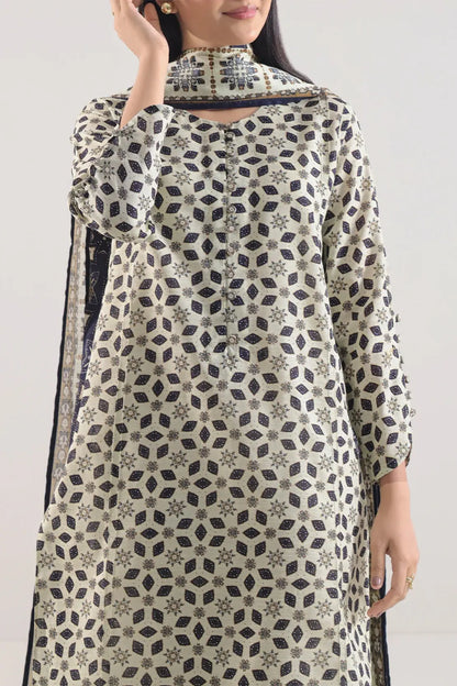 Woman wearing a patterned dress with a plain background