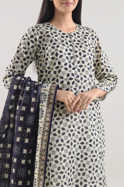 Woman wearing a patterned kurta with a plain background
