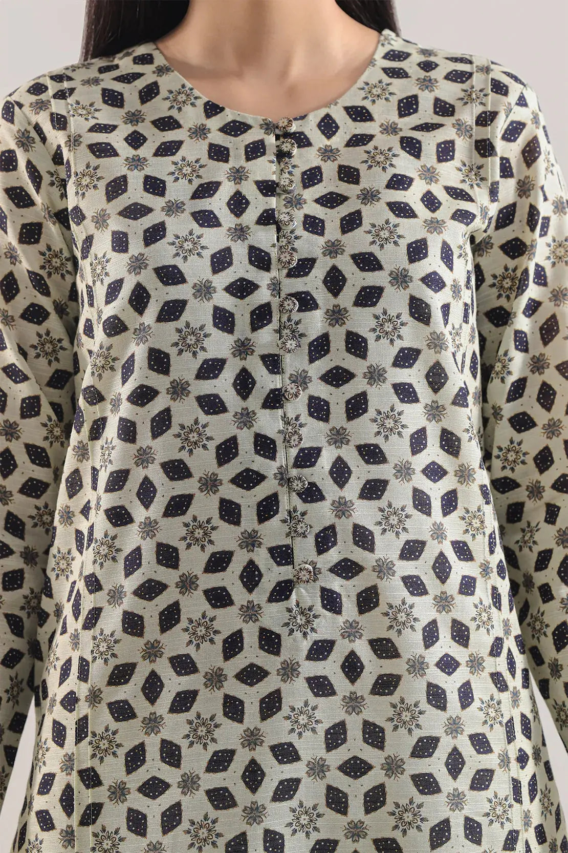 Patterned shirt worn by a person on a plain background
