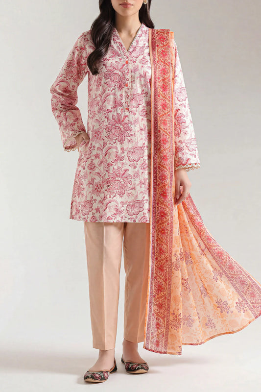 Woman wearing a pink floral kurta with beige pants and matching dupatta on a white background