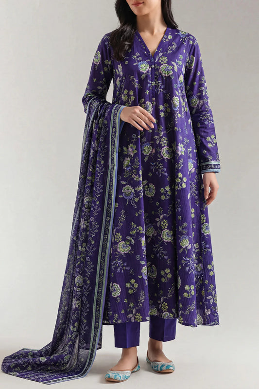 Woman wearing a purple floral dress with a matching dupatta on a plain background