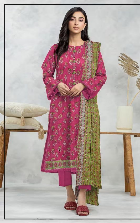 Woman wearing a pink and green traditional outfit with a white background