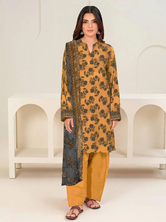 Woman wearing a mustard yellow kurta with black floral patterns and palazzo pants against a white background.