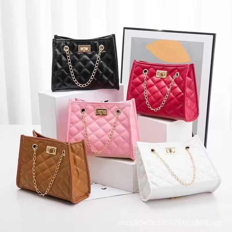 Four quilted handbags in black, pink, brown, and white with gold chains on a white background.