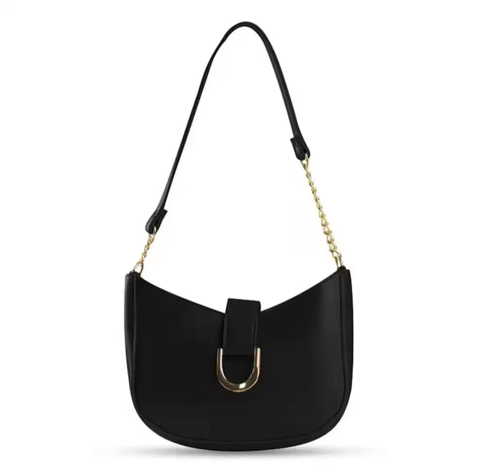 Black handbag with a gold chain strap on a white background
