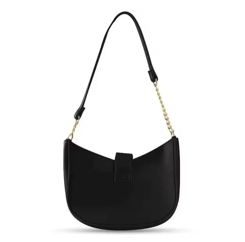 Black handbag with a gold chain strap on a white background