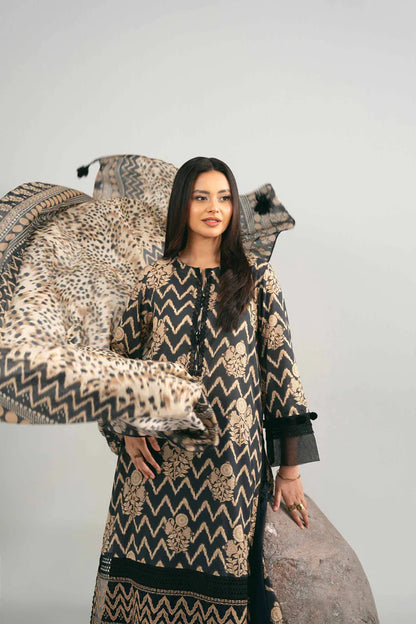 Woman in a patterned outfit standing next to decorative chairs with animal print and geometric designs.