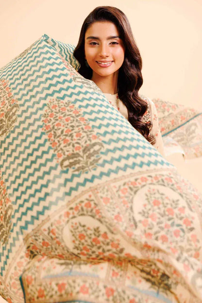 Woman wrapped in a patterned Dupata with a neutral background