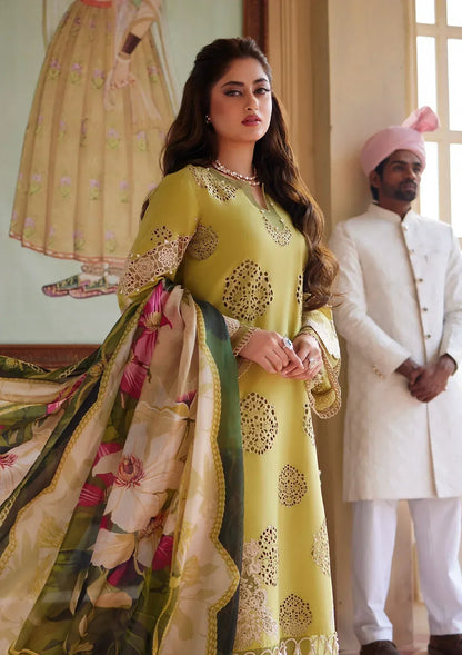 Woman in a traditional outfit with a man in formal attire in the background