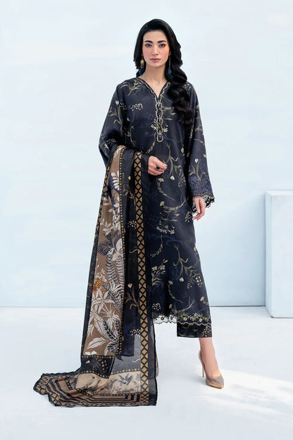 Woman wearing a dark floral dress with a matching dupatta on a white background