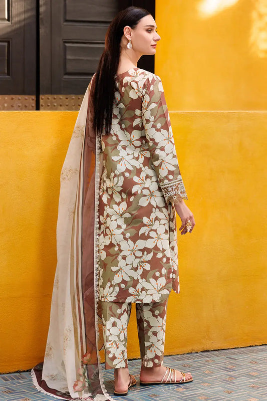Woman wearing a floral dress with a yellow wall in the background