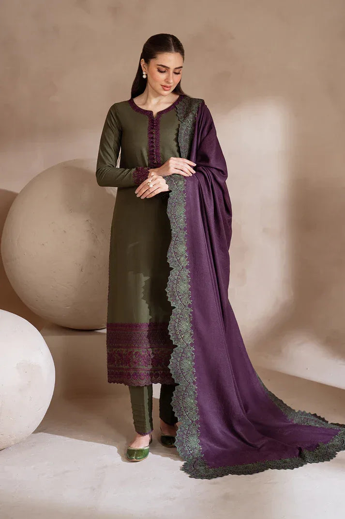 Woman wearing a green and purple traditional outfit with a matching dupatta against a neutral background