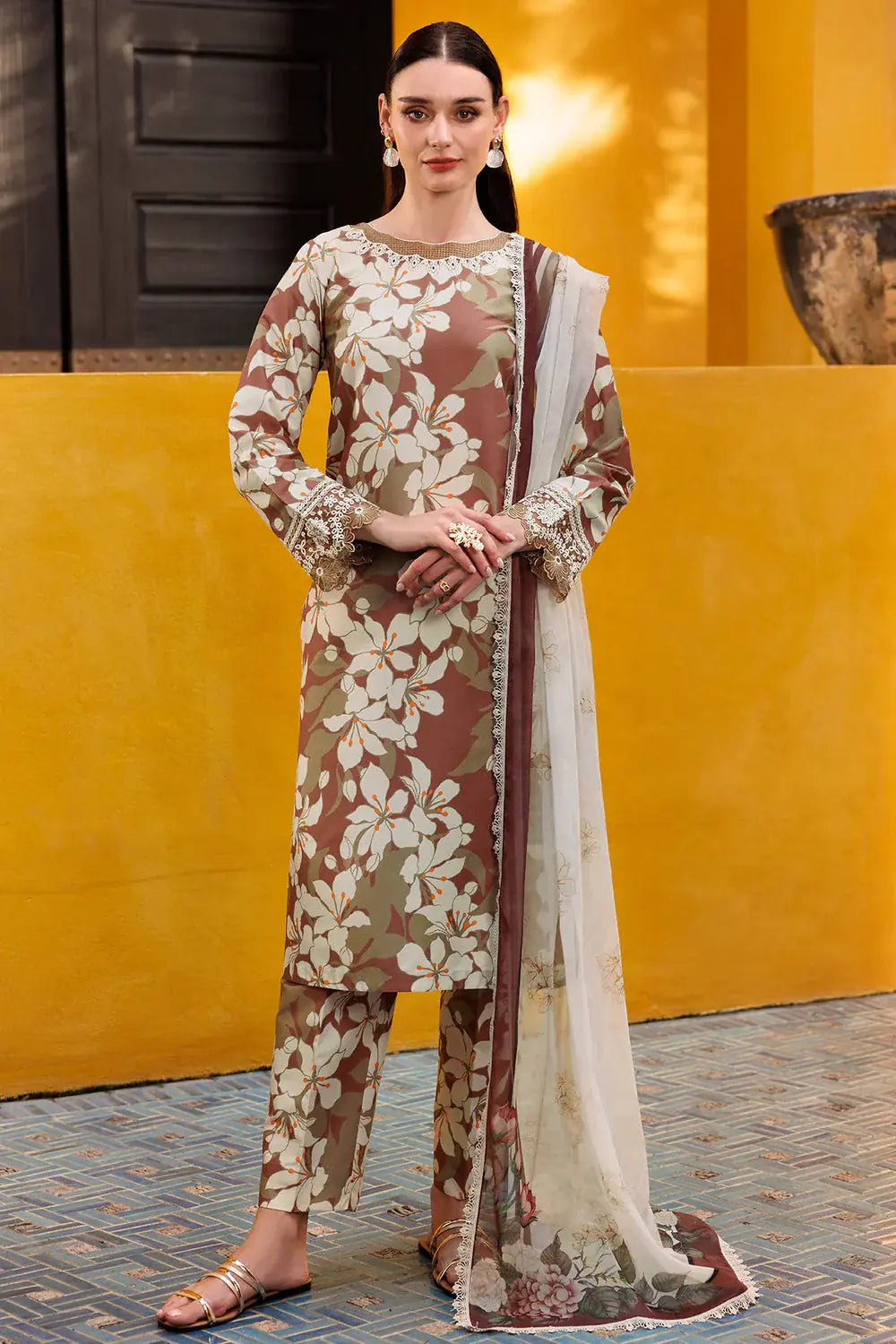 Woman wearing a floral patterned outfit with a yellow background