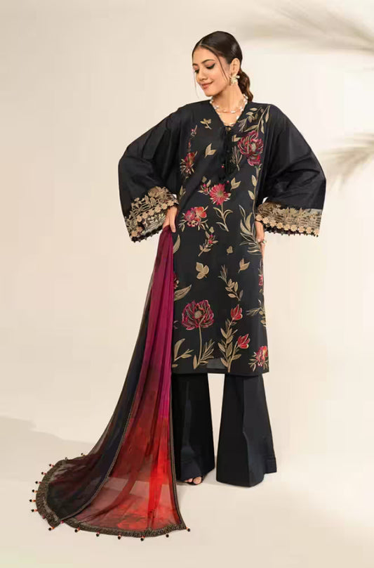 Woman wearing a black embroidered outfit with a red dupatta on a white background