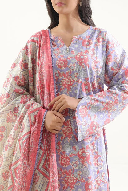 Woman wearing a floral kurta with a matching dupatta on a white background
