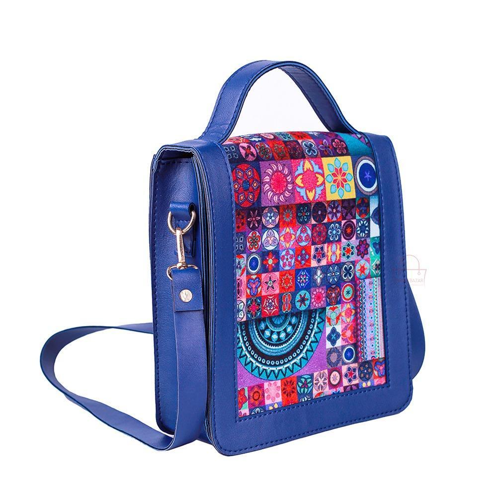 Blue handbag with a colorful pattern on a white background