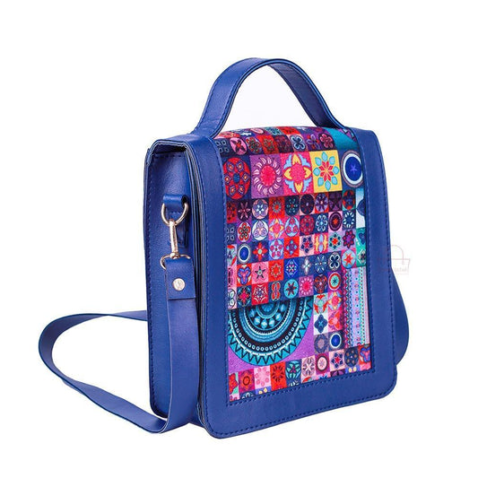 Blue handbag with a colorful pattern on a white background
