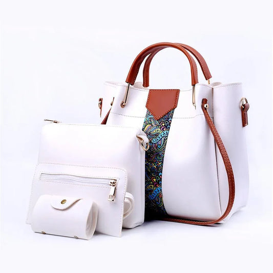 White handbag with brown handles and strap featuring colorful pattern on a white background