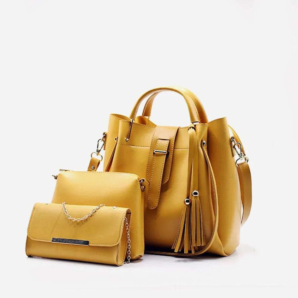 Yellow handbag and matching pouch on a white background