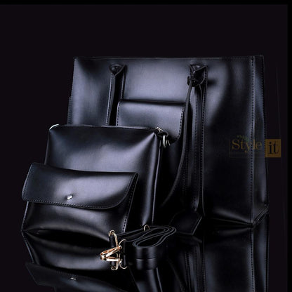 Black leather bags including a backpack and clutch on a reflective surface with 'Style it' branding.