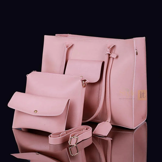 Set of pink handbags on a reflective surface with a black background