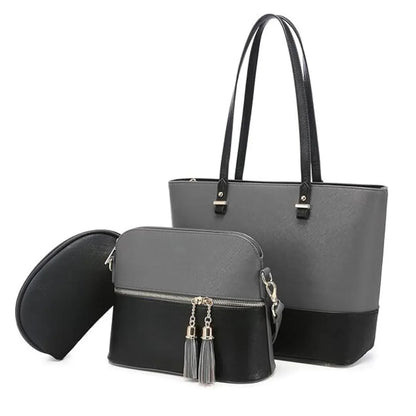 Two-handled gray tote bag with a smaller black bag featuring tassels on a white background