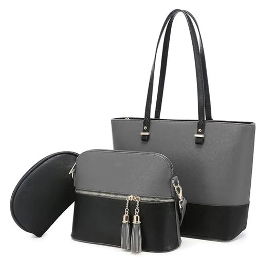 Two-handled gray tote bag with a smaller black bag featuring tassels on a white background