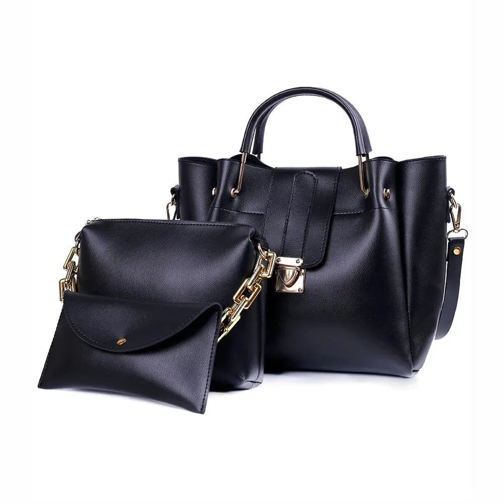 Black handbag with gold accents on a white background