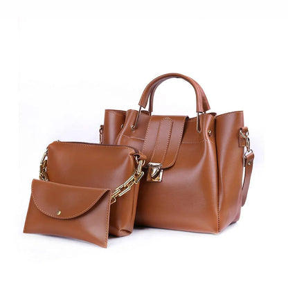 Brown leather handbag with matching pouch on a white background