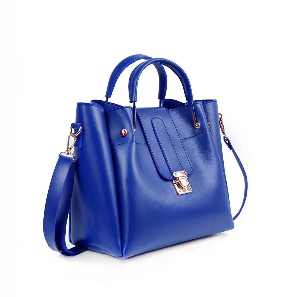 Blue handbag with gold accents on a white background