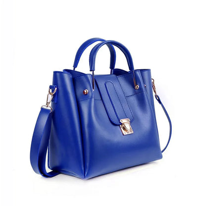 Blue handbag with gold accents on a white background