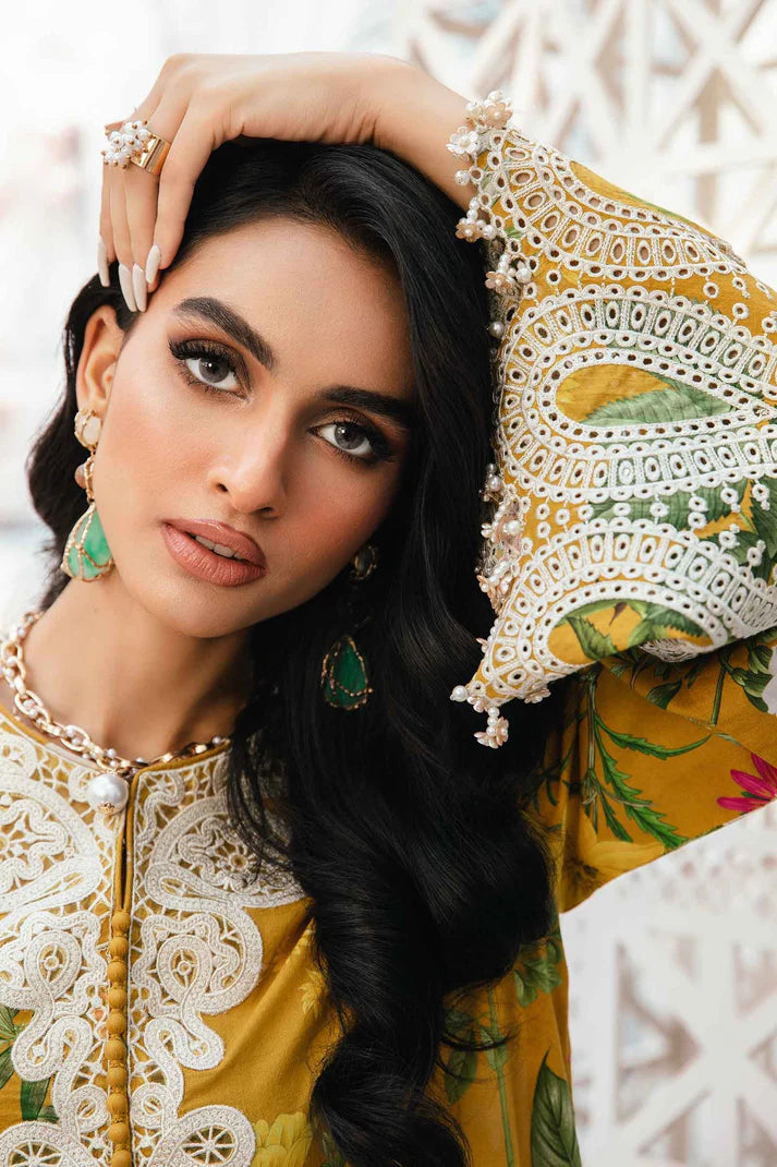 Woman wearing traditional yellow and green outfit with intricate patterns