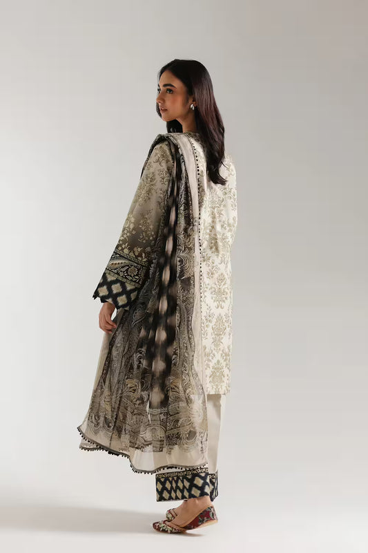 Woman wearing a traditional outfit with intricate patterns on a plain background