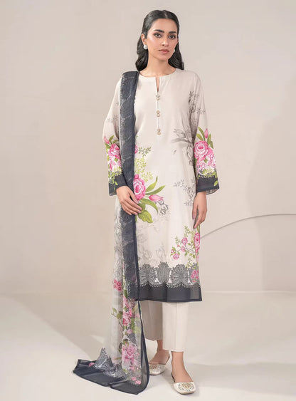 Woman wearing a floral embroidered outfit with a plain background