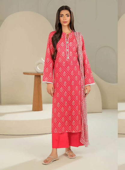 Woman wearing a red patterned outfit with a matching dupatta in a minimalistic setting.